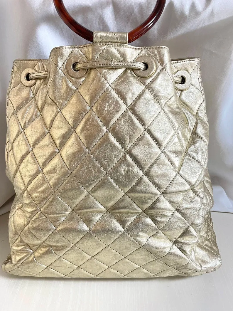 Chanel Vintage Campaign Gold Lamb Leather Hobo Bucket Bag With Marble Hoop Handles And Turn Lock Cc