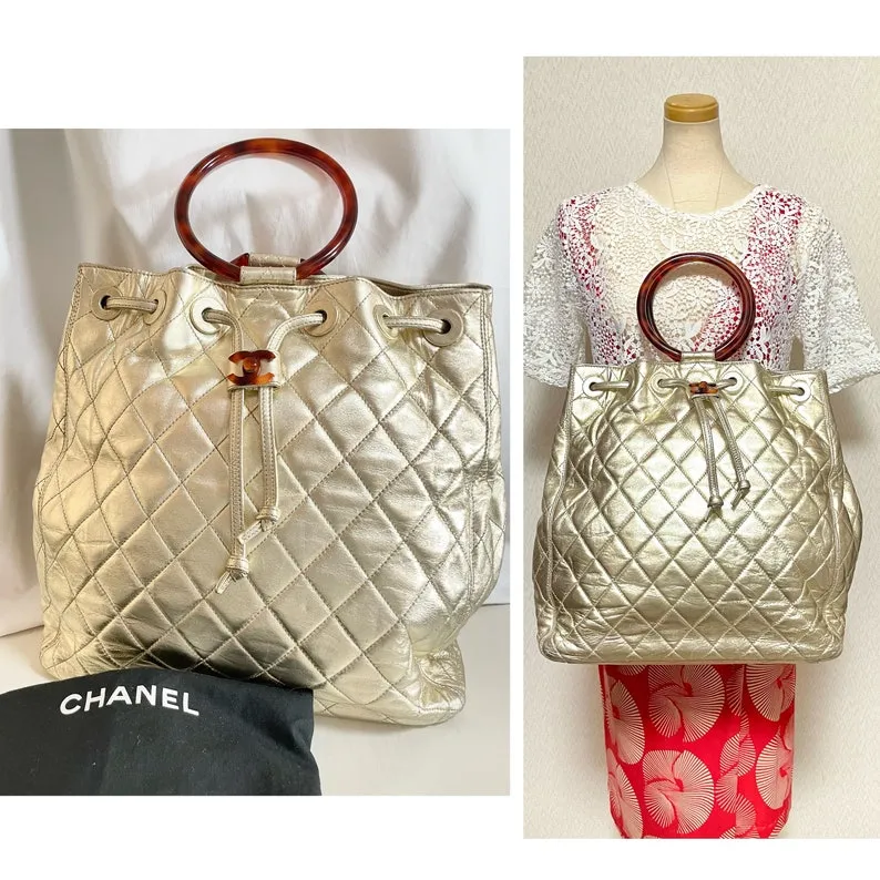 Chanel Vintage Campaign Gold Lamb Leather Hobo Bucket Bag With Marble Hoop Handles And Turn Lock Cc
