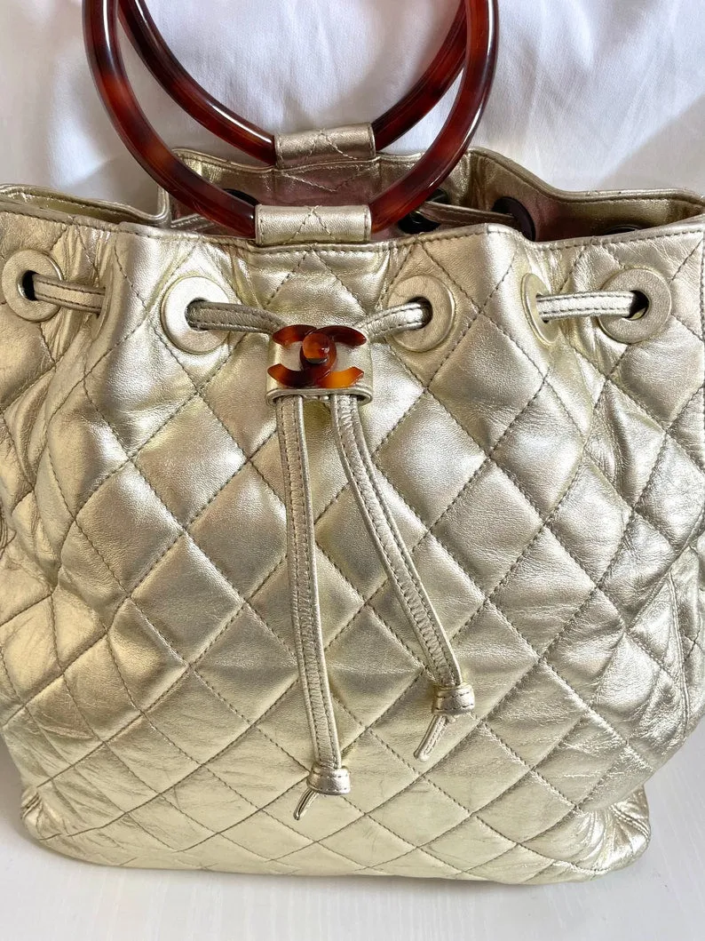 Chanel Vintage Campaign Gold Lamb Leather Hobo Bucket Bag With Marble Hoop Handles And Turn Lock Cc